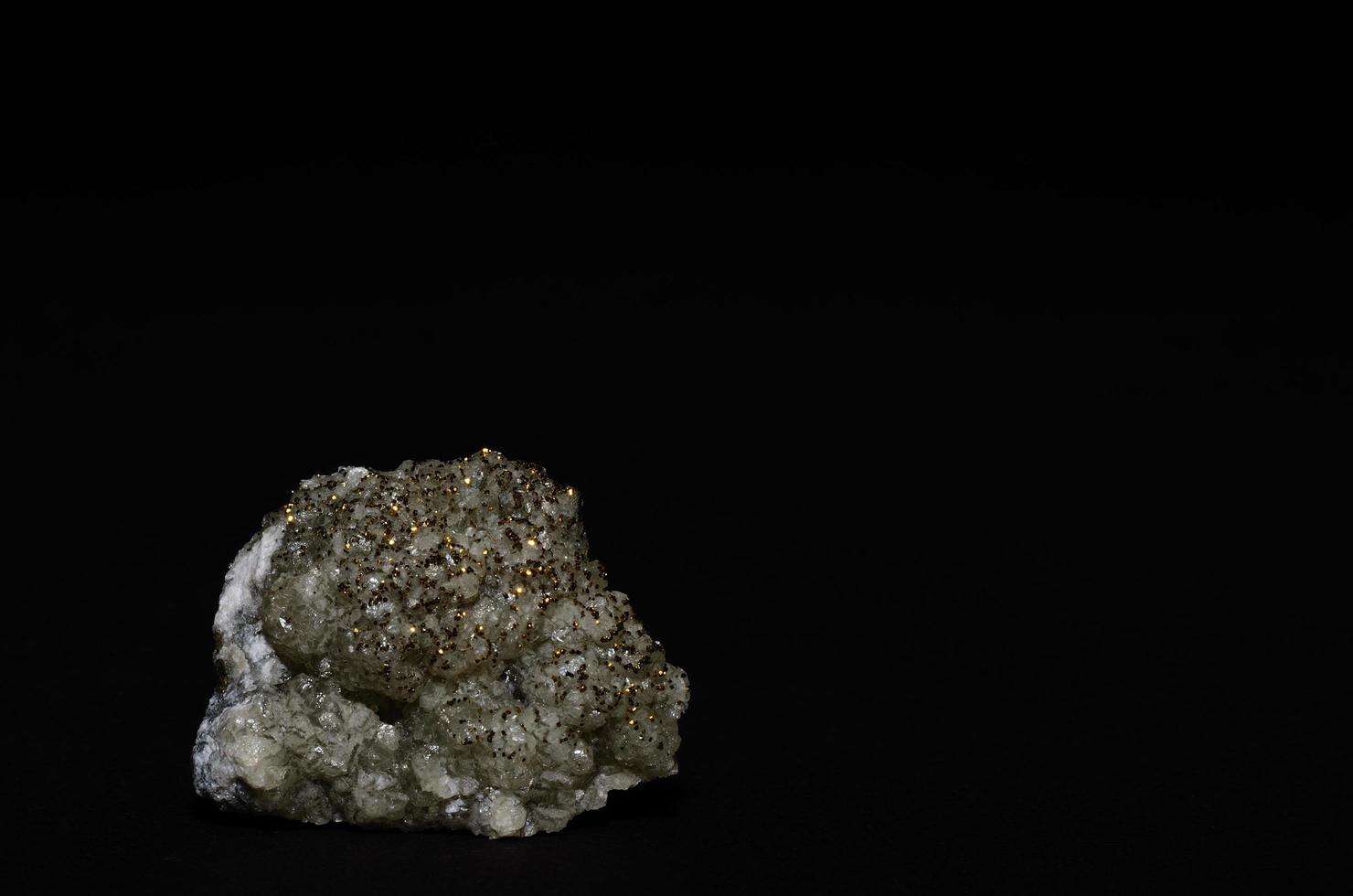 round calcite pyrite pieces and black photo