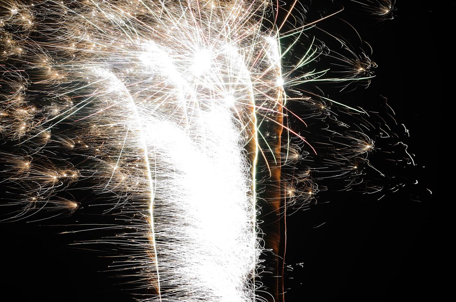 brightly fireworks in the night photo