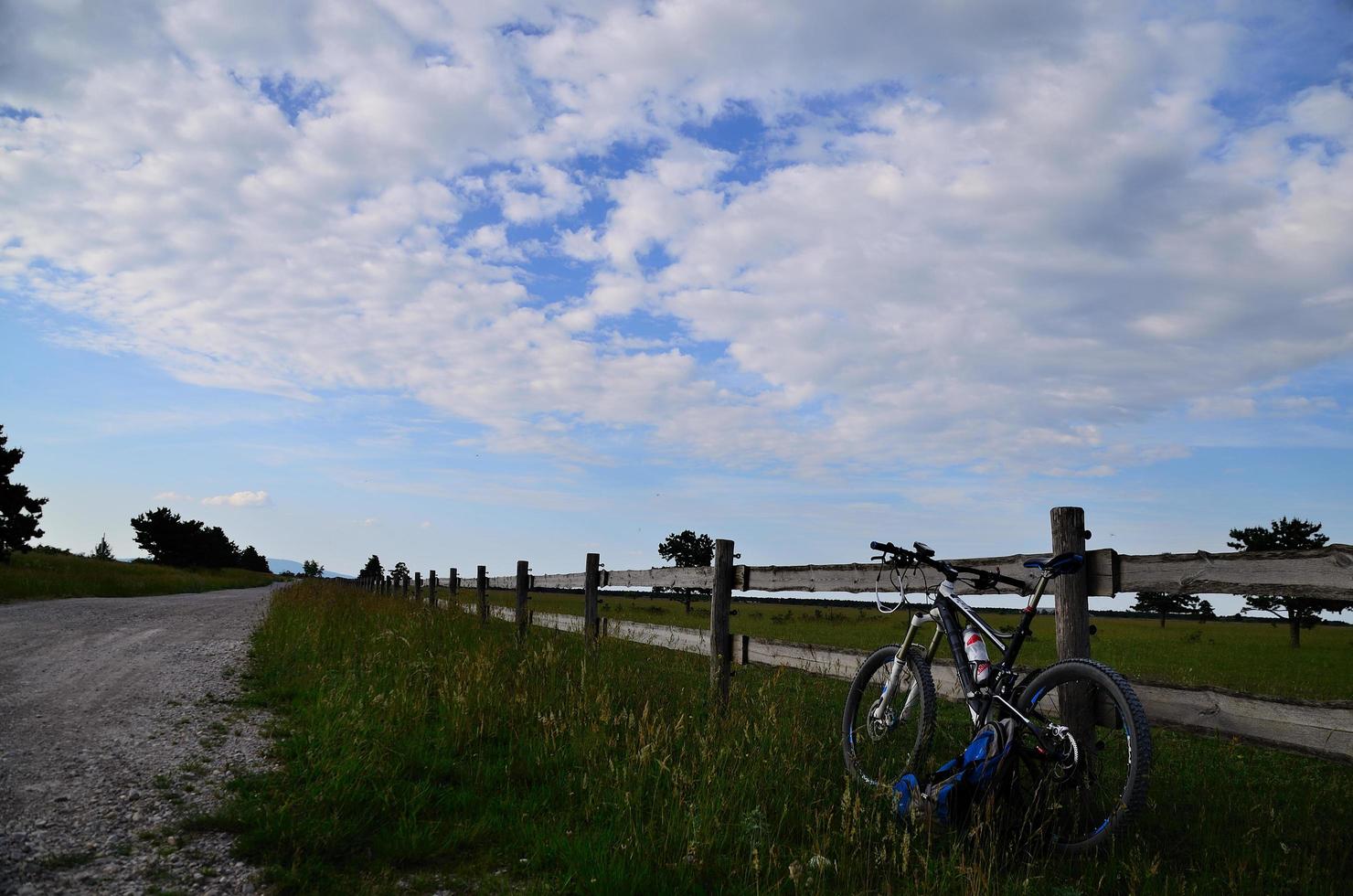 mountainbike on fence of ranch photo