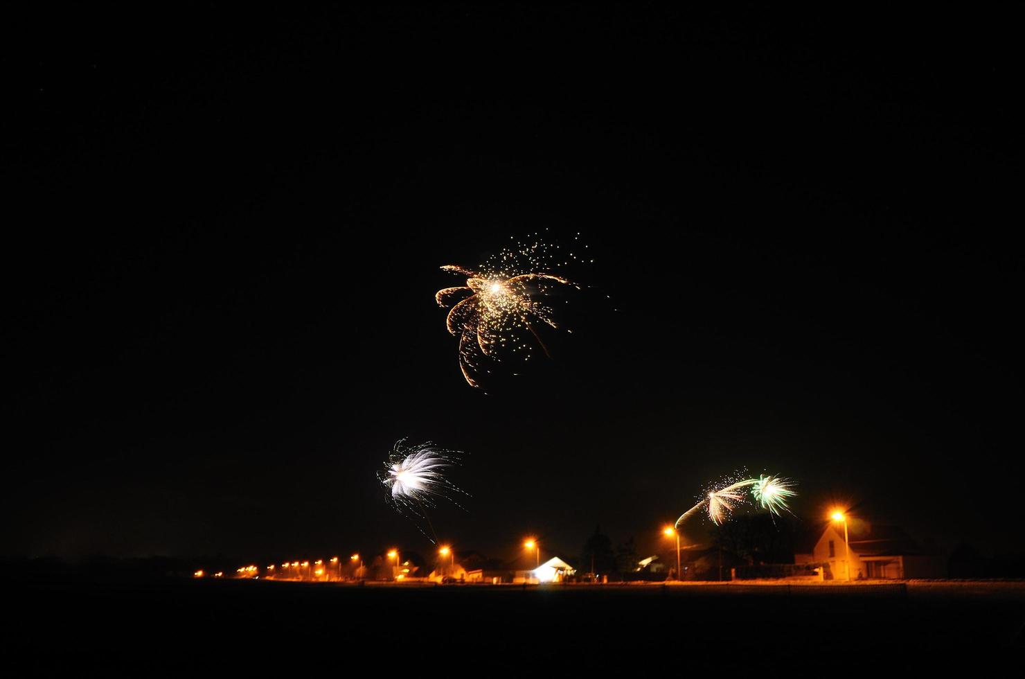 fireworks with street lighting photo