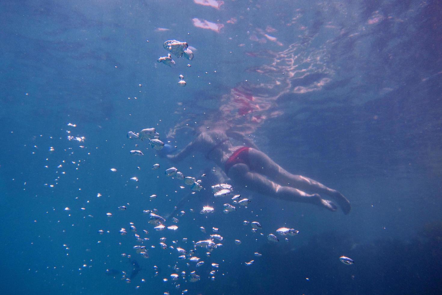 woman with red bikini with bubbles photo