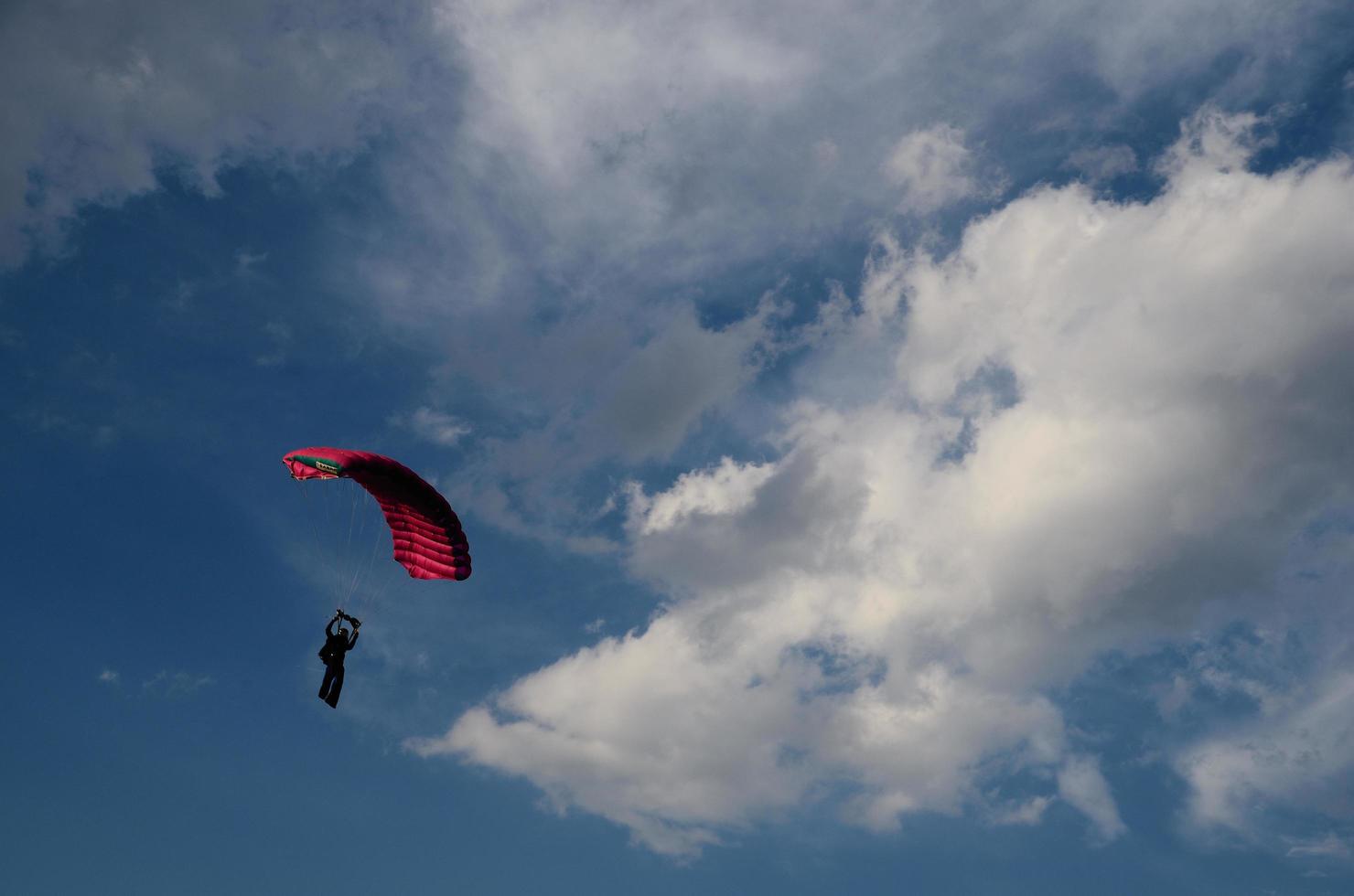 skydiver with clouds photo