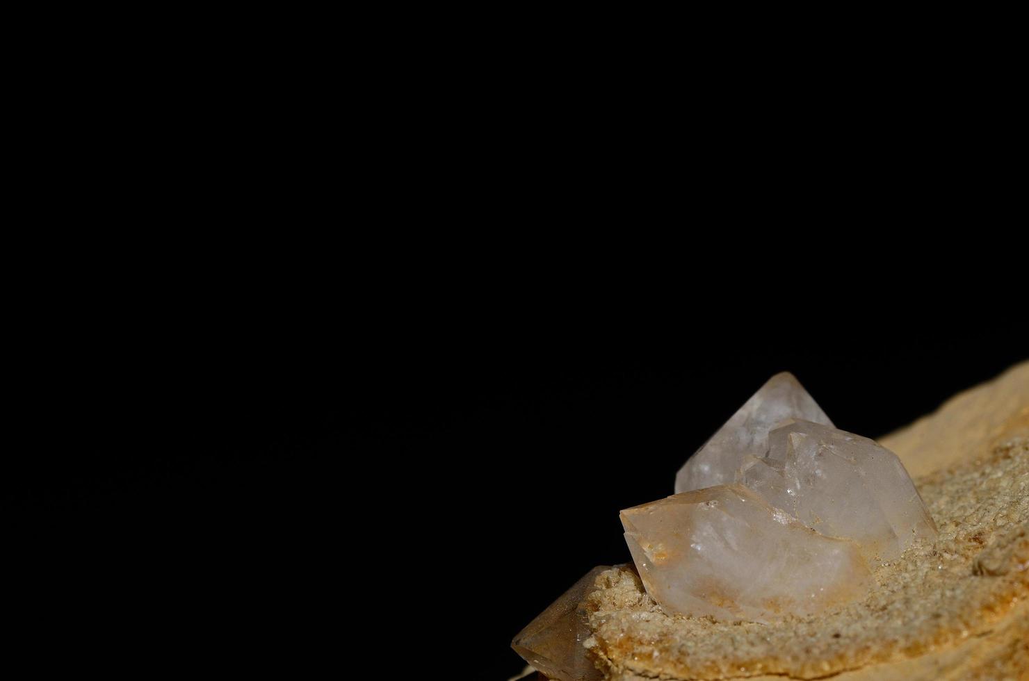 rock crystal on stone and black photo