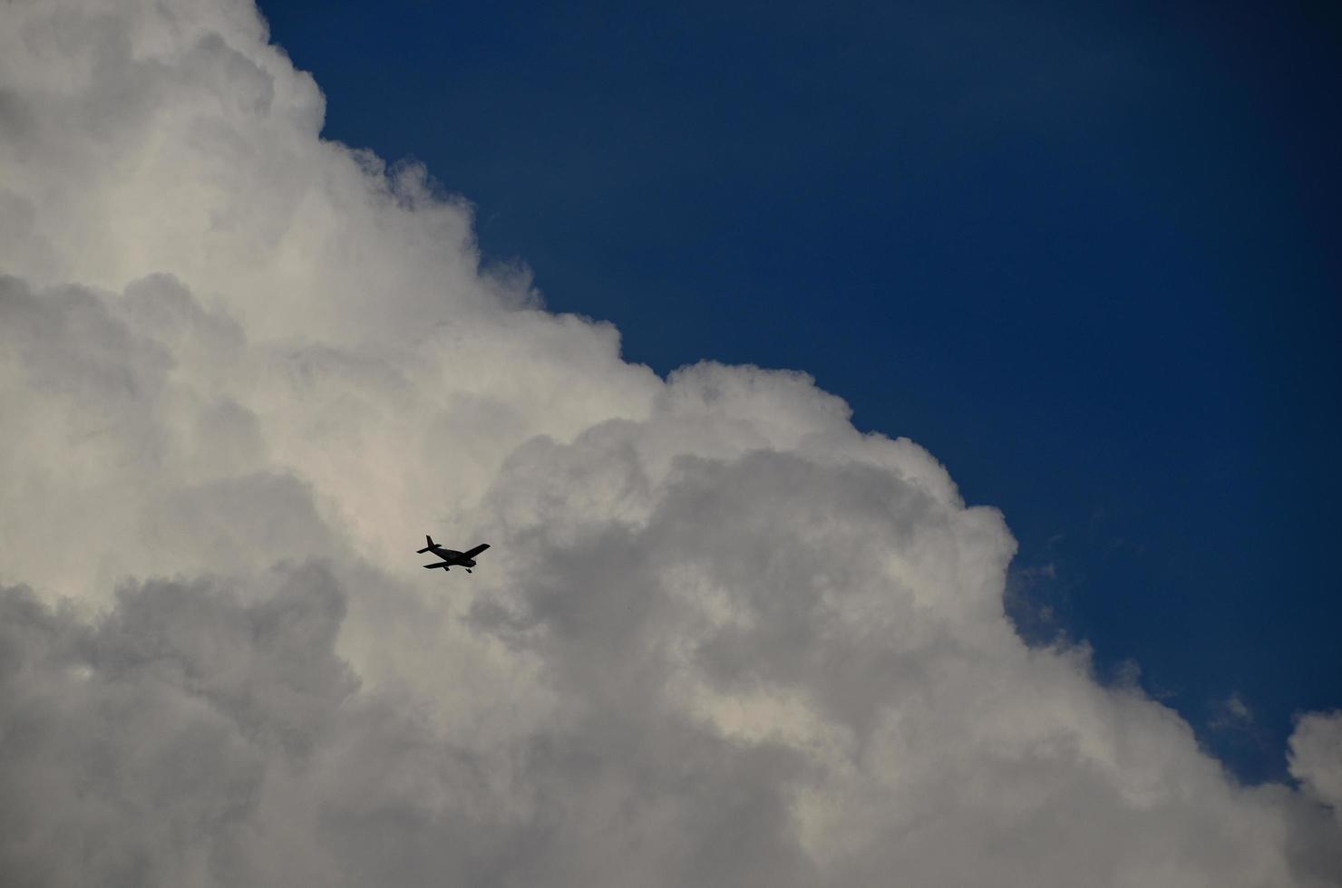 small plane and clouds photo