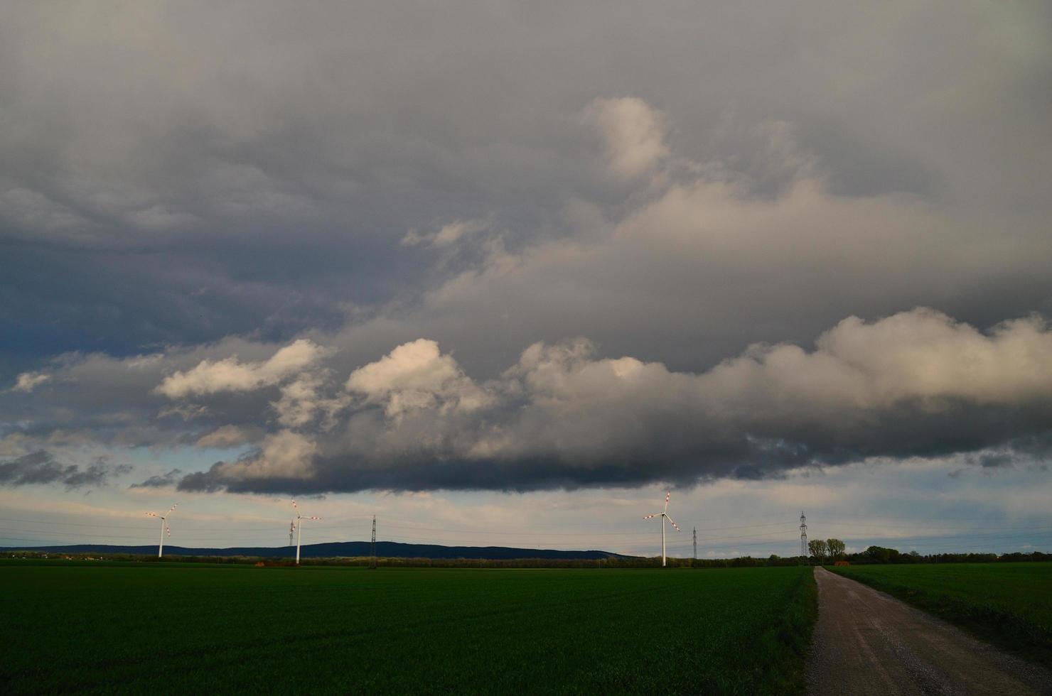 storm clouds and wind wheels photo