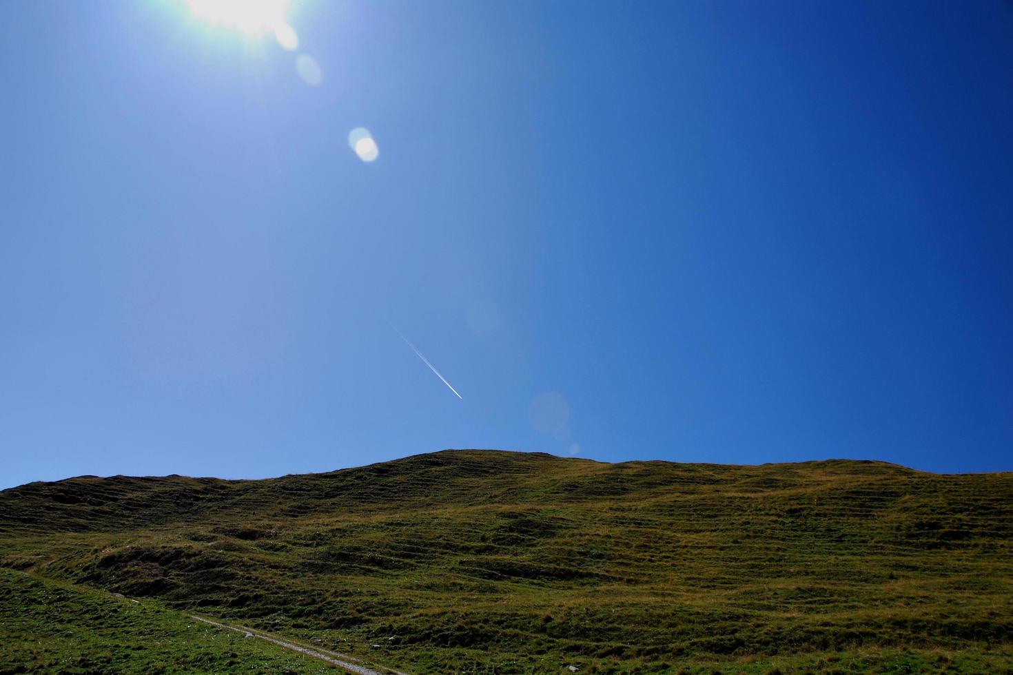 green hill while hiking photo