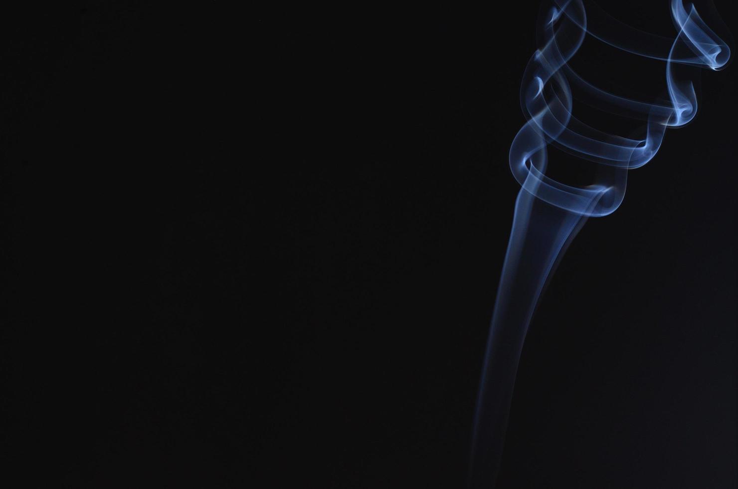 smoke turns with black background photo