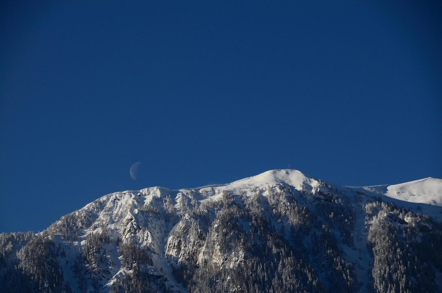 mountain with snow and moon photo