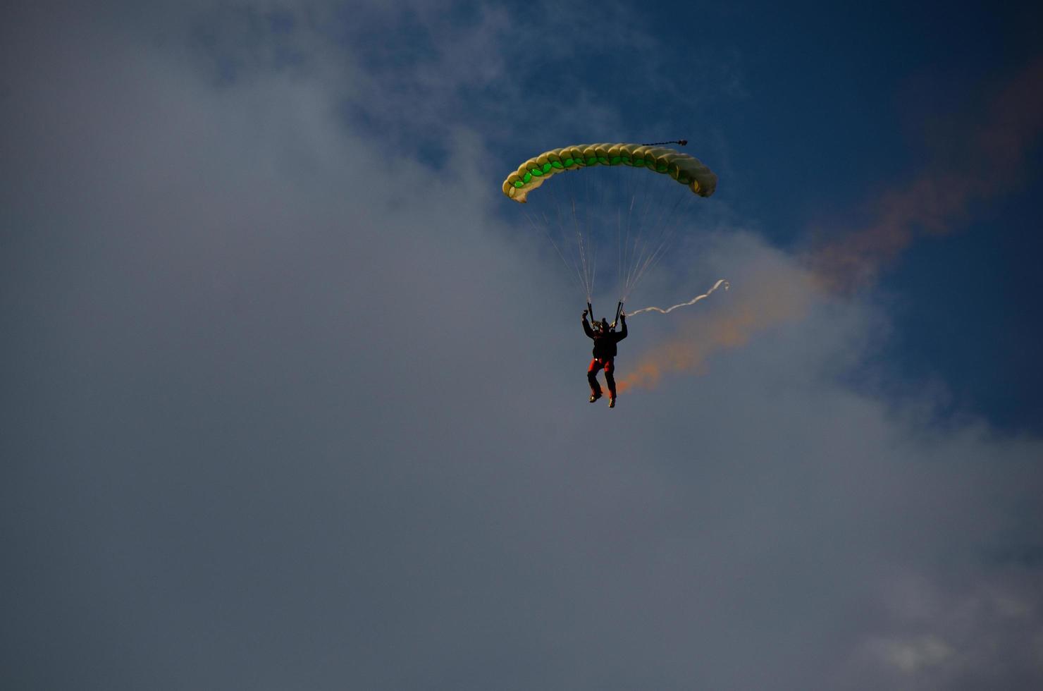 skydiver with smoke photo