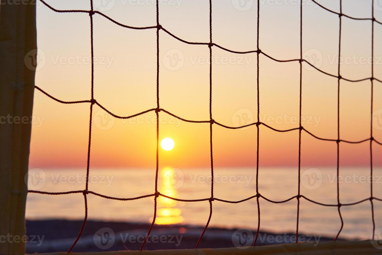 Beautiful colorful sunset over the sea and the sun shines. Orange sky. photo