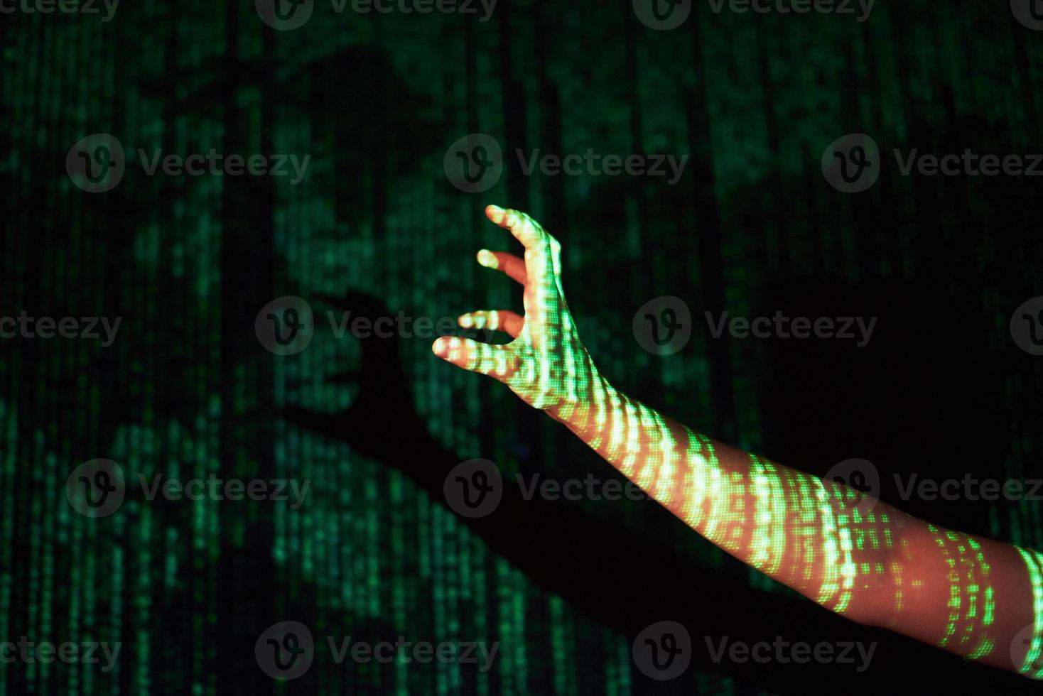 Double exposure of a caucasian man and Virtual reality VR headset is presumably a gamer or a hacker cracking the code into a secure network or server, with lines of code photo