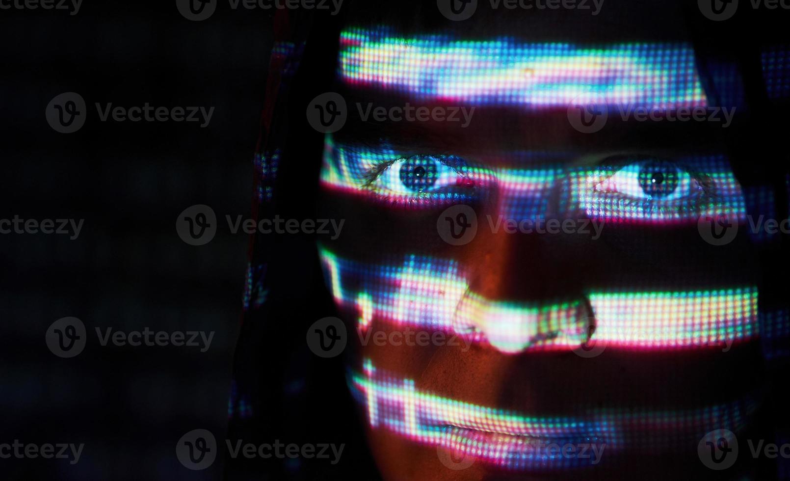 Cyber attack with unrecognizable hooded hacker using virtual reality, digital glitch effect photo