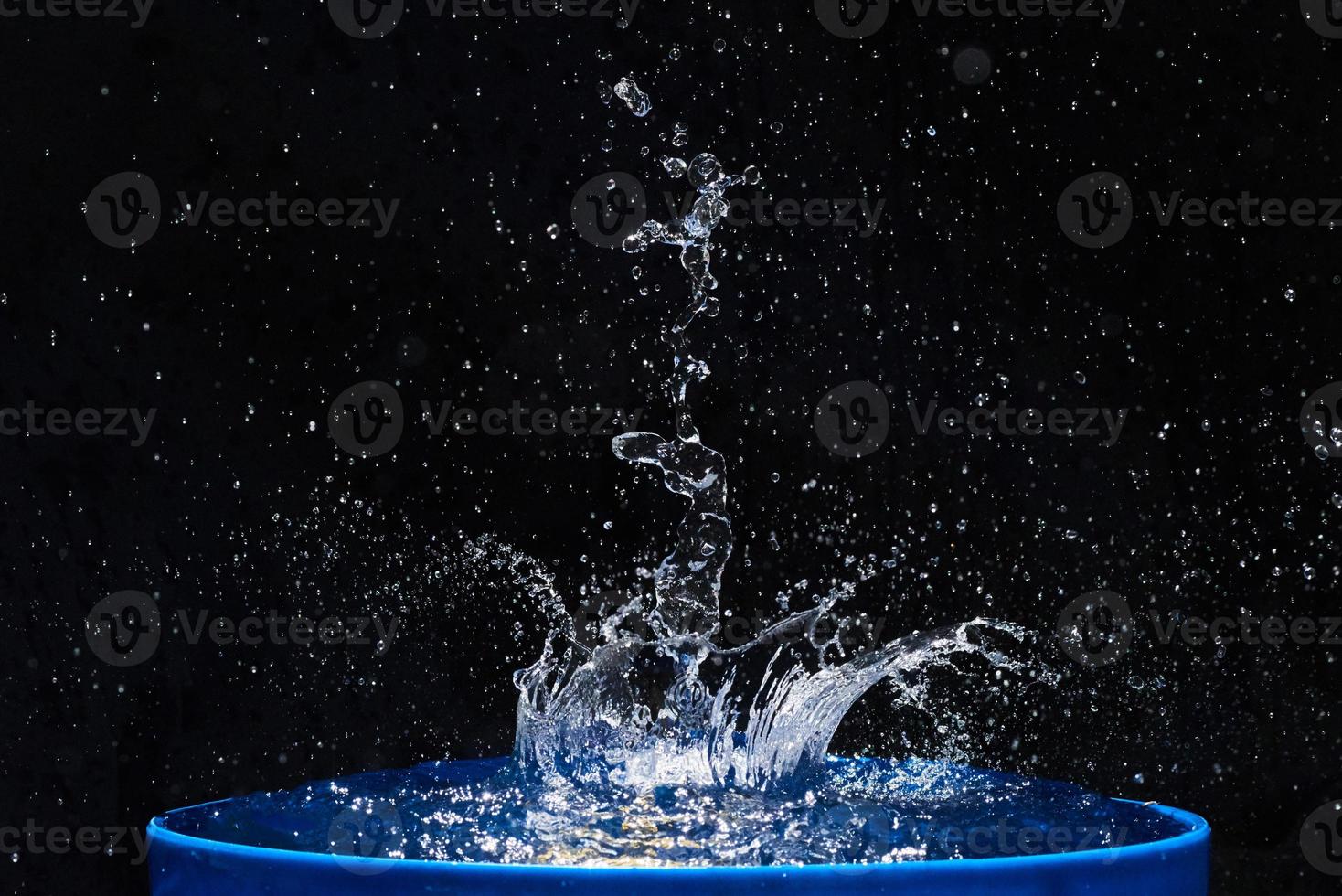 Blue water drops falling down. photo