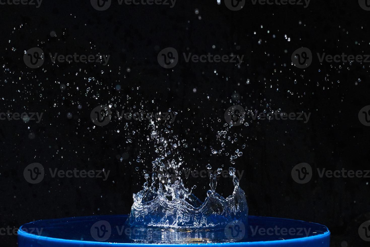 Splash water, water splashes, isolated on black background. photo