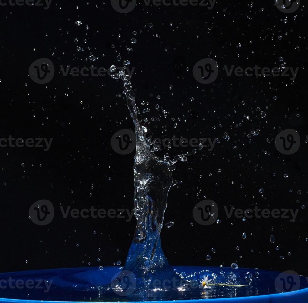 water splashes, isolated on a black background photo