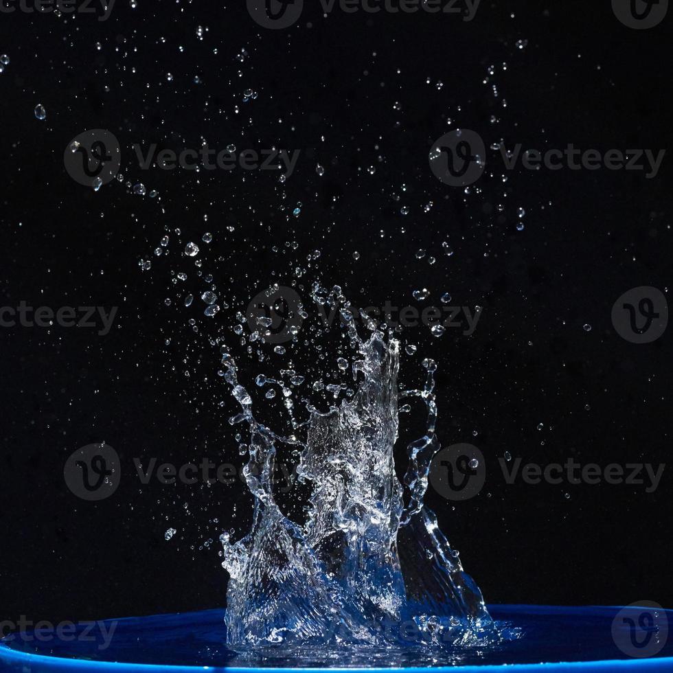 water splashes, isolated on a black background photo