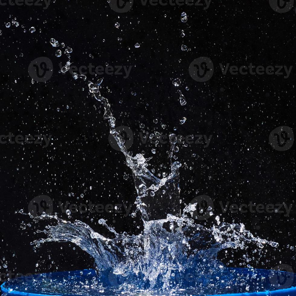 water splashes, isolated on a black background photo