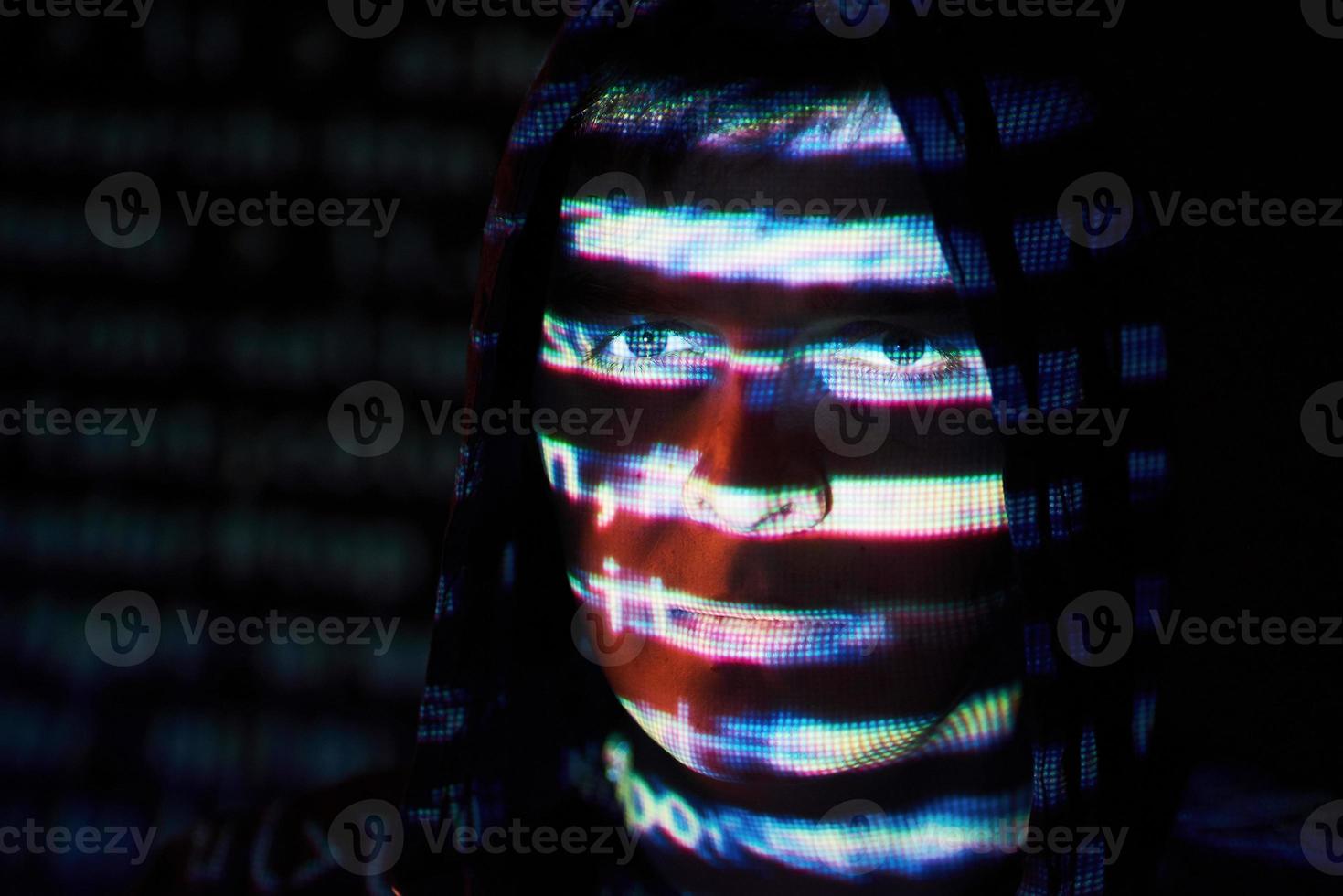 Cyber attack with unrecognizable hooded hacker using virtual reality, digital glitch effect photo