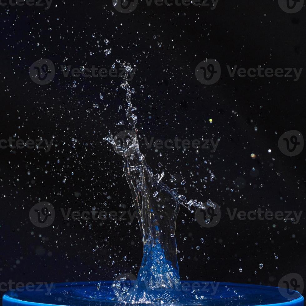 water splashes, isolated on a black background photo