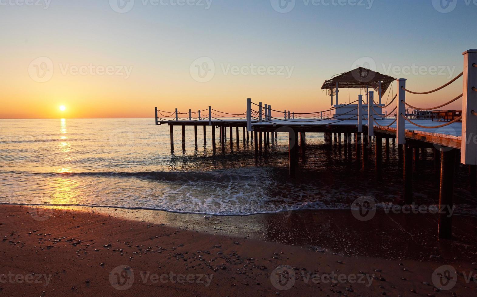 Wooden bridge pier against a beautiful sky measure used for natural background, background and multi-stage sea photo