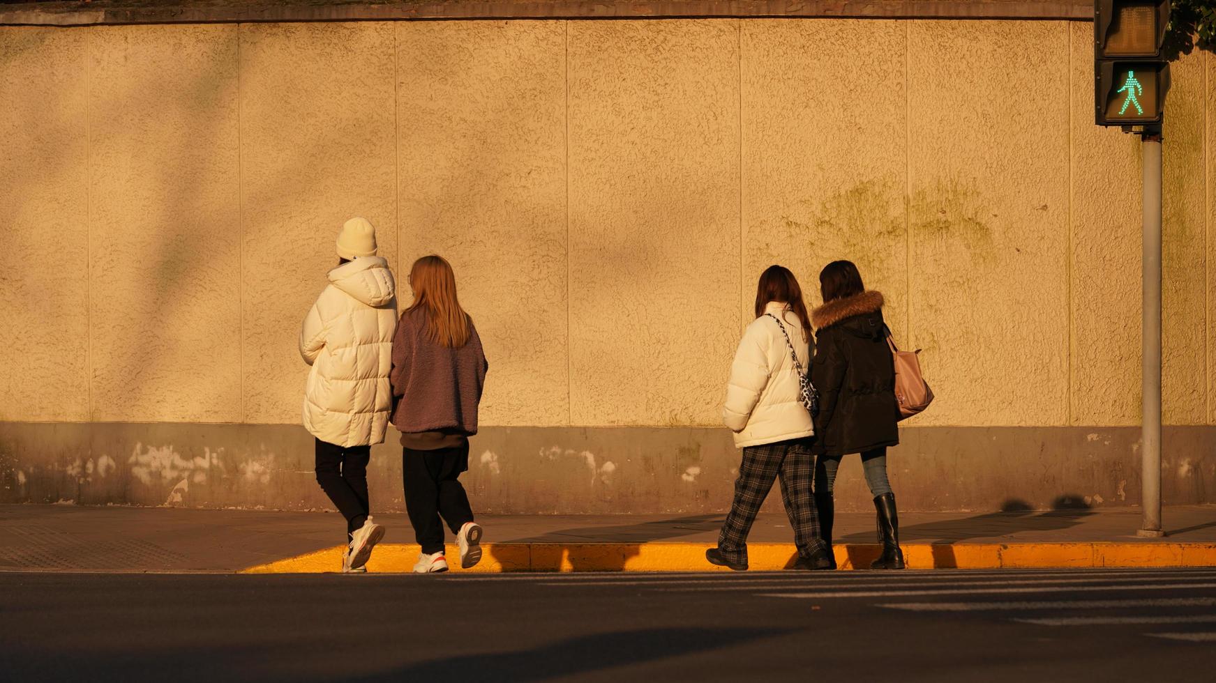 Shanghai city, China, 2021-The street view of people in sunlight photo