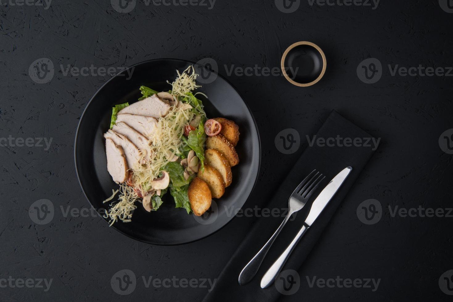 a meat dish on a black surface photo