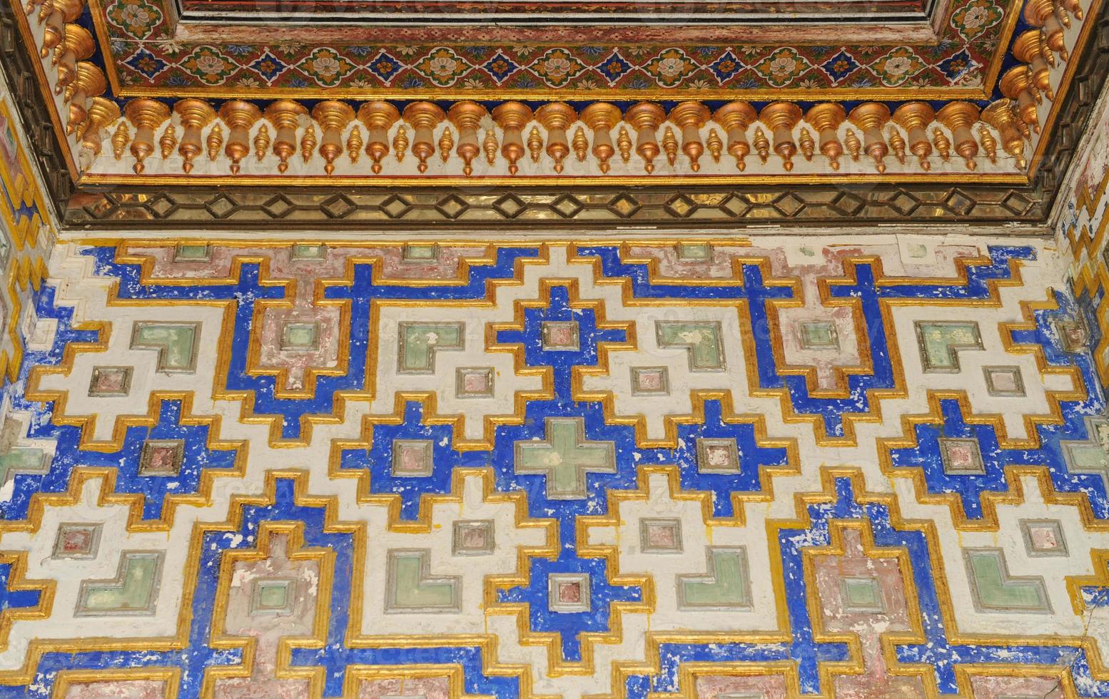 Elements of ancient architecture of Central Asia. Ceiling in the form of a dome in a traditional ancient Asian mosaic photo