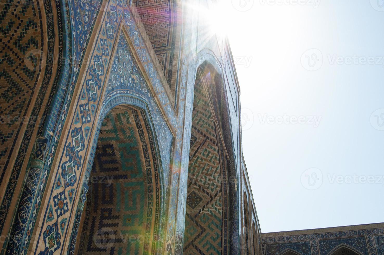 Arch and architecture of the ancient Registan in Samarkand. Ancient architecture of Central Asia photo