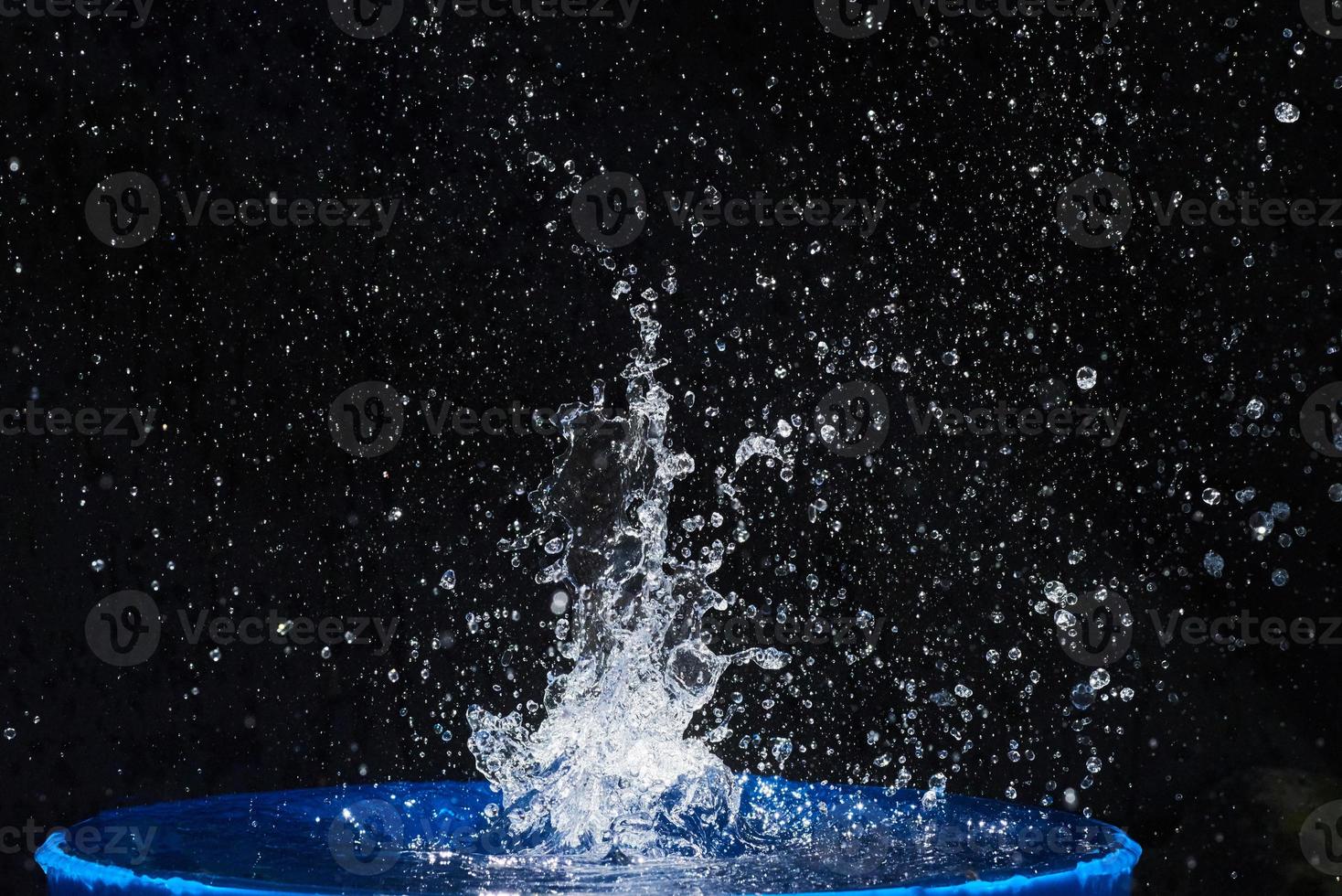 water splashes, isolated on a black background photo