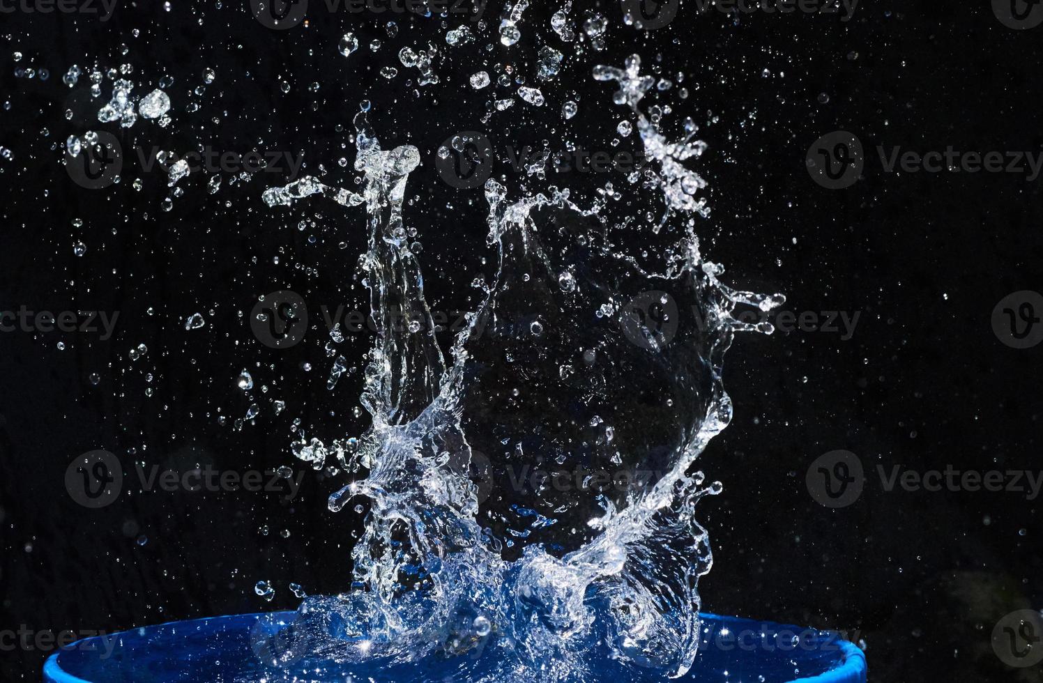 water splashes, isolated on a black background photo