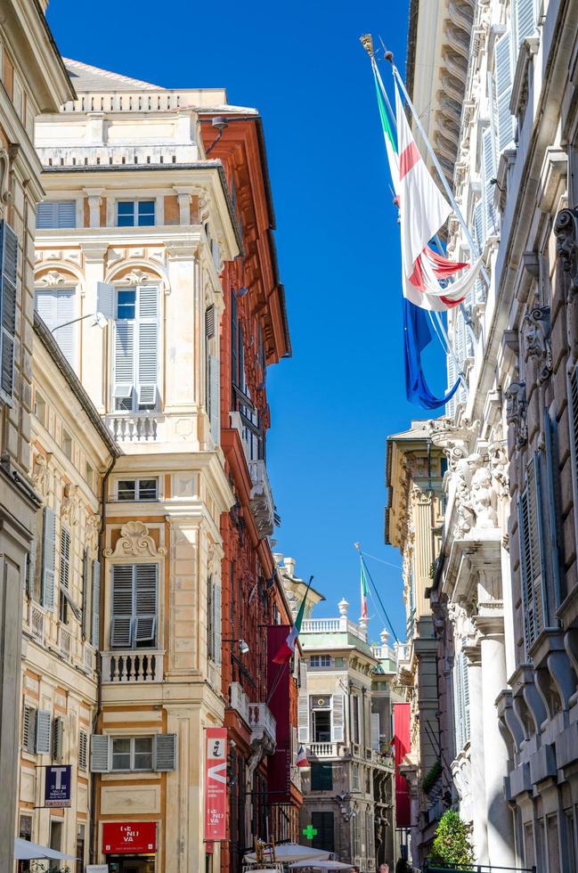 Genoa, Italy, September 11, 2018 Red palace Palazzo Rosso and Palazzo Doria Tursi colorful typical buildings on Via Garibaldi street in historical centre of old european city Genova, Liguria photo