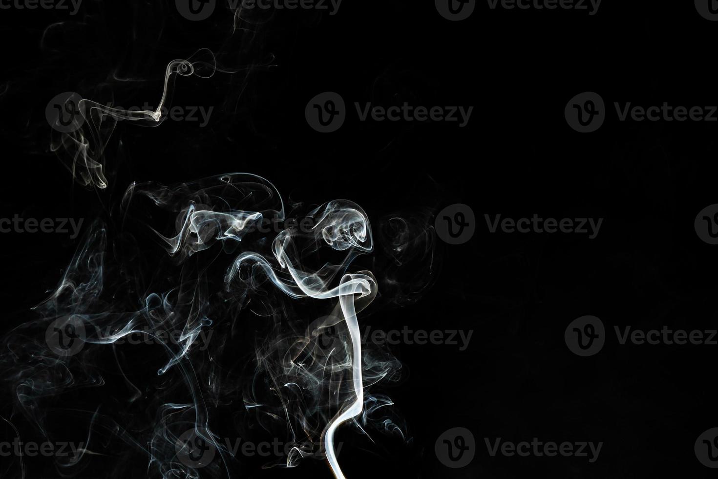 Smoke effect texture. Isolated background. Black and dark backdrop. Smokey fire and mistic effect. photo