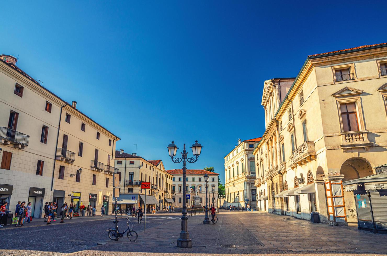 Vicenza, Italy building and street light in Piazza del Castello cobblestone square photo