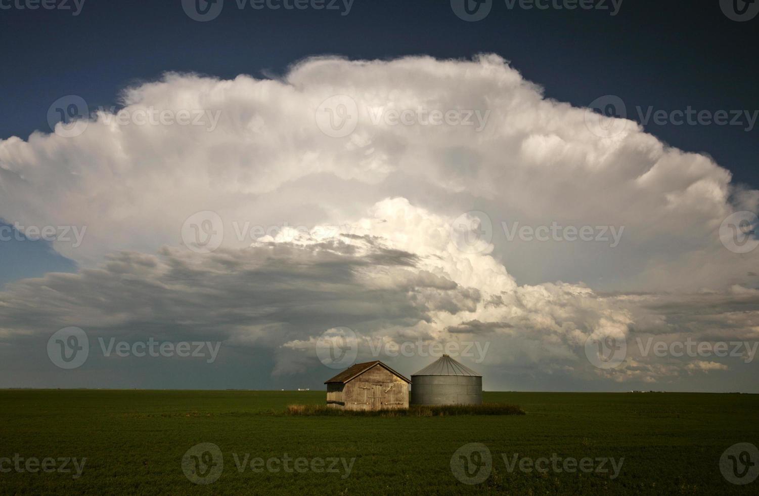 Storm clouds over Saskatchewan granaries photo