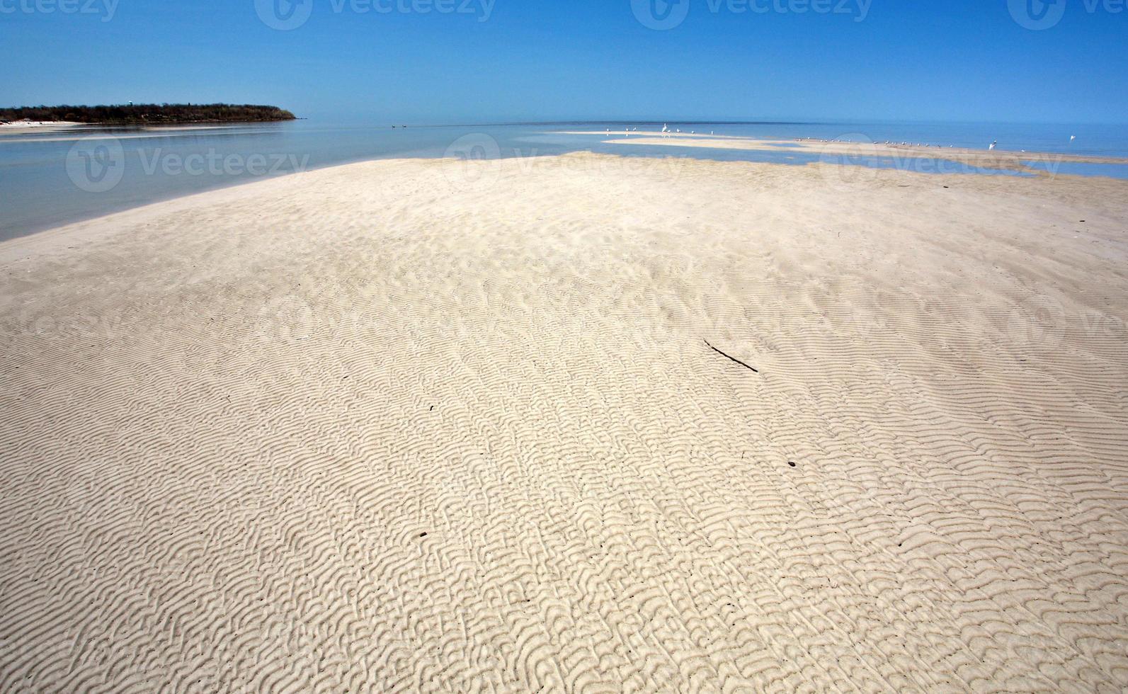 Sand flats along shore of Lake Winnipeg photo