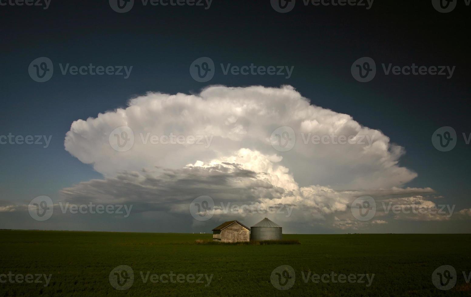Storm clouds over Saskatchewan granaries photo