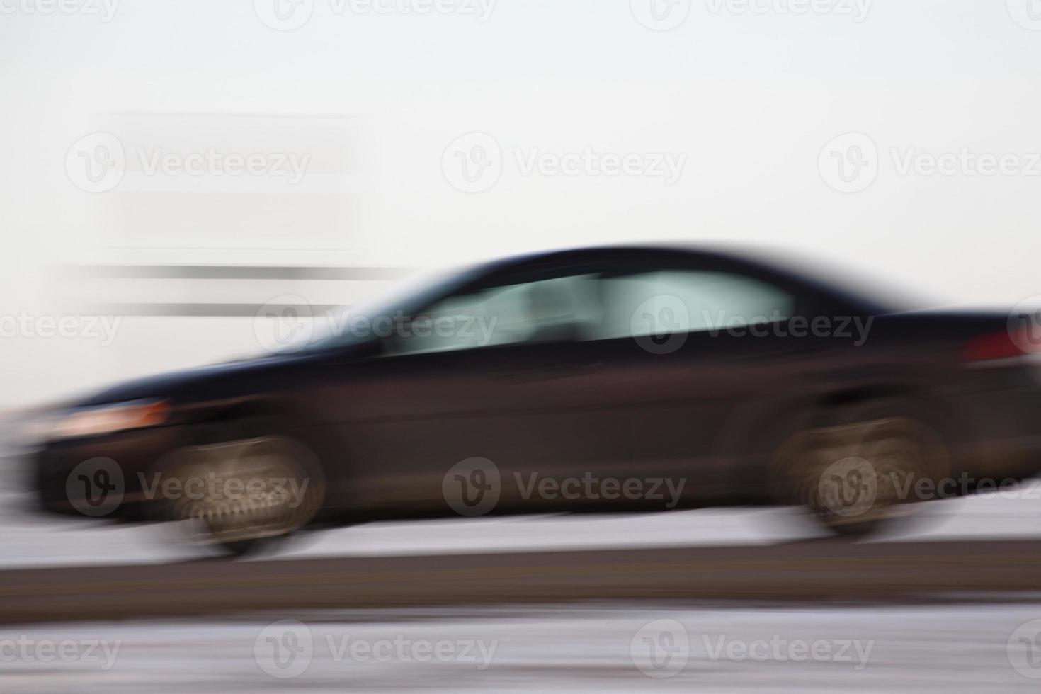 Blurred automobile on highway photo