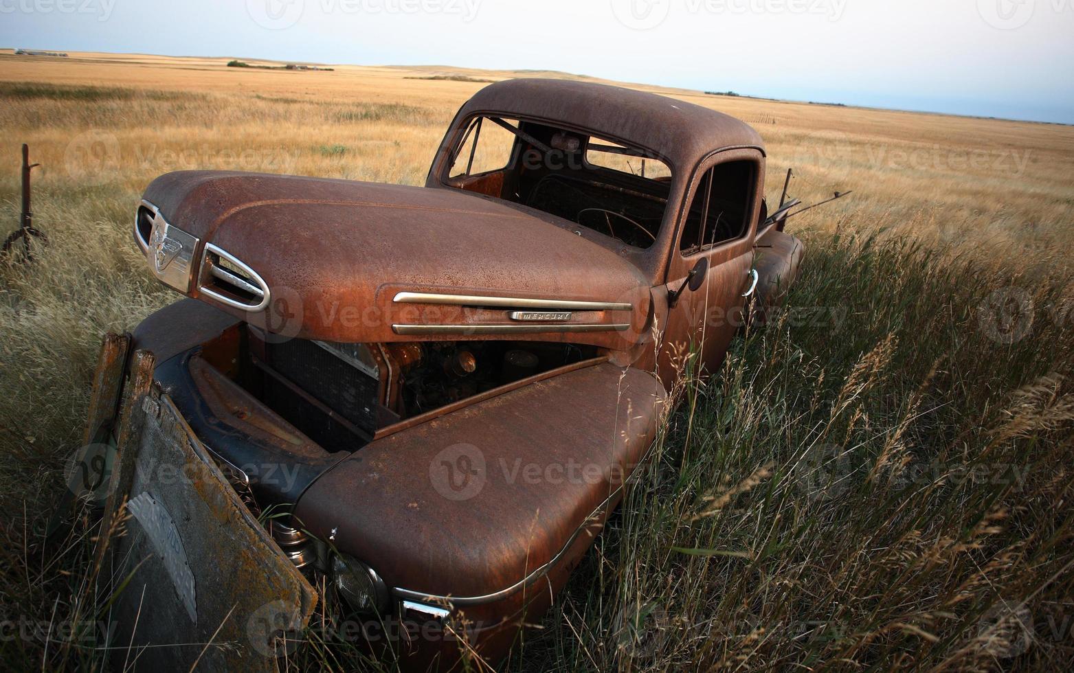Abandoned farm truck in scenic Saskatchewan photo