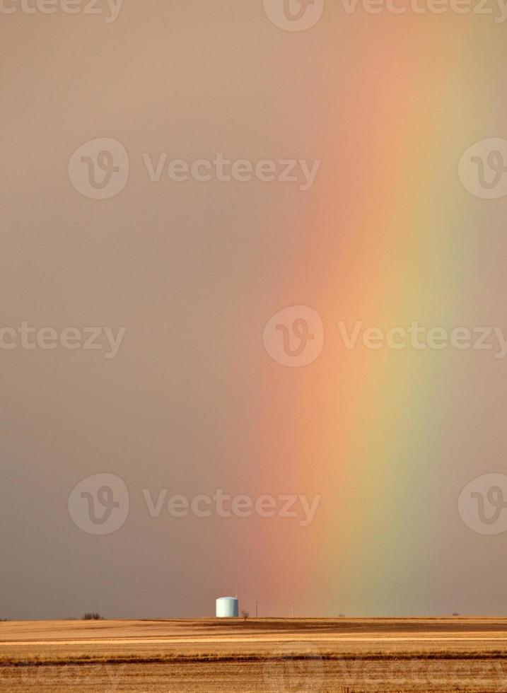 Rainbow behind silo in scenic Saskatchewan photo