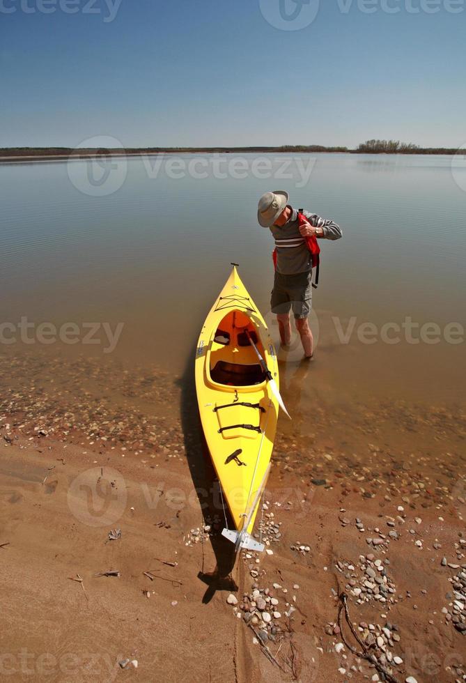 Kayak on beach at Lake Winnipeg photo