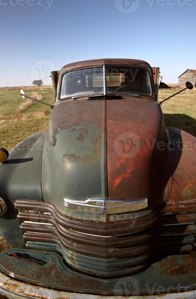 Antique Chevy farm truck in old farmyard photo