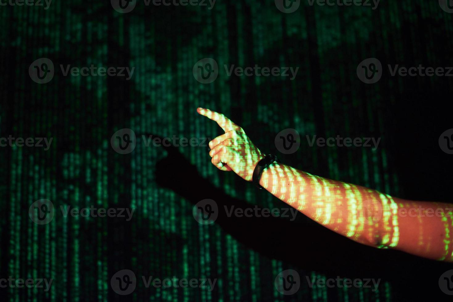 Double exposure of a caucasian man and Virtual reality VR headset is presumably a gamer or a hacker cracking the code into a secure network or server, with lines of code photo