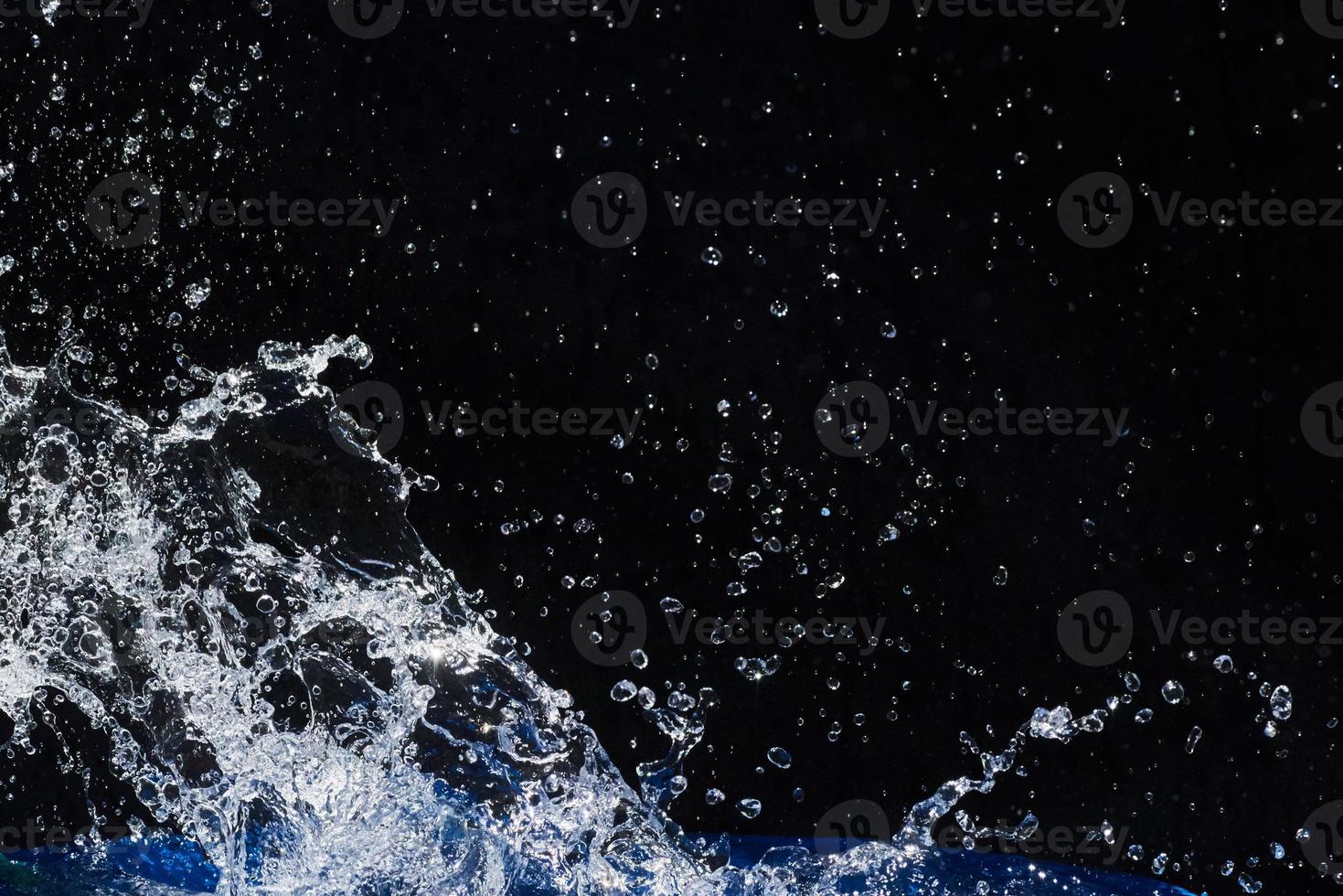 Beautiful blue water drops falling down photo