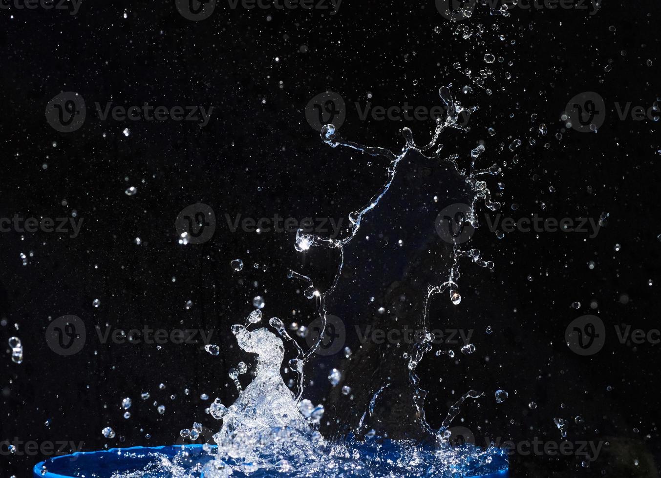 water splashes, isolated on a black background photo