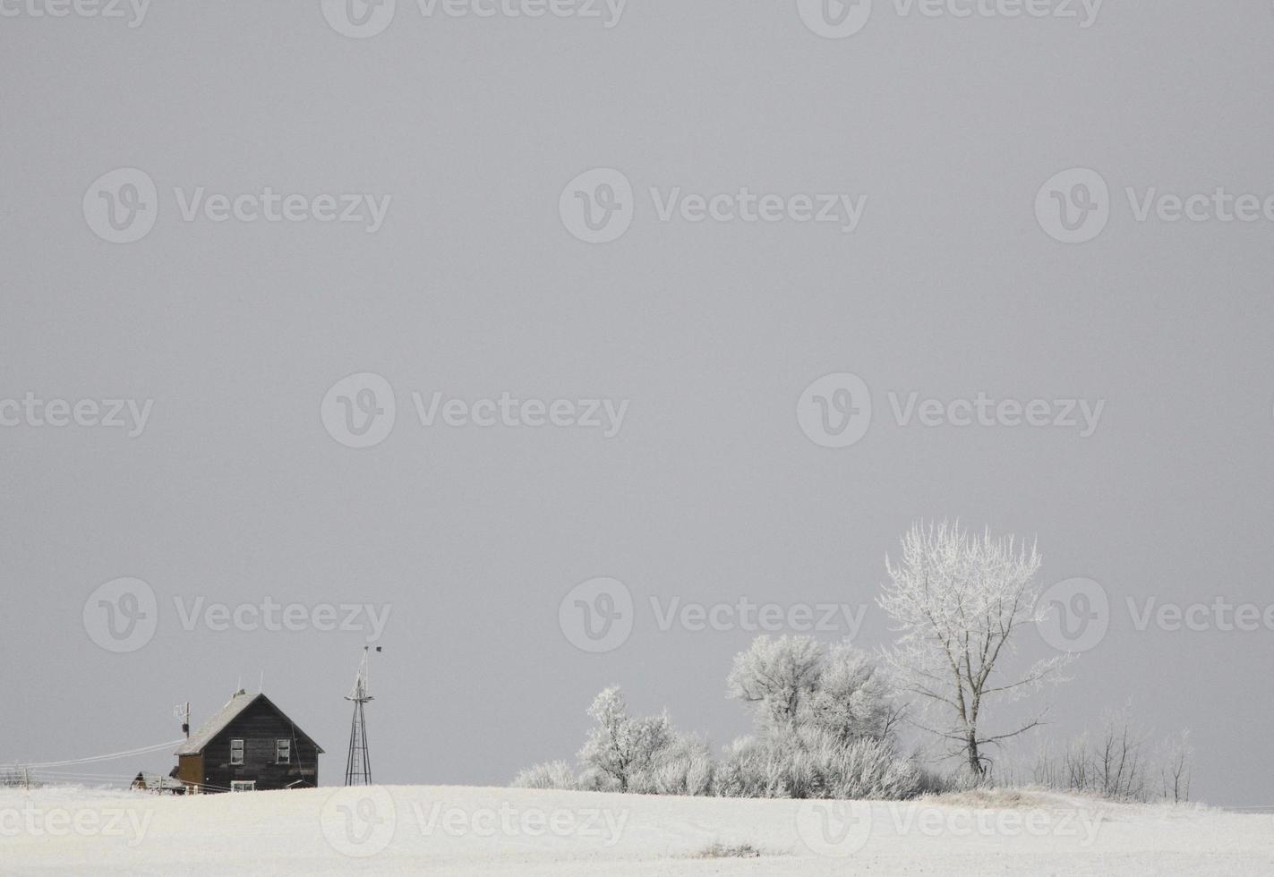 Abandoned farm house on a frosty day photo
