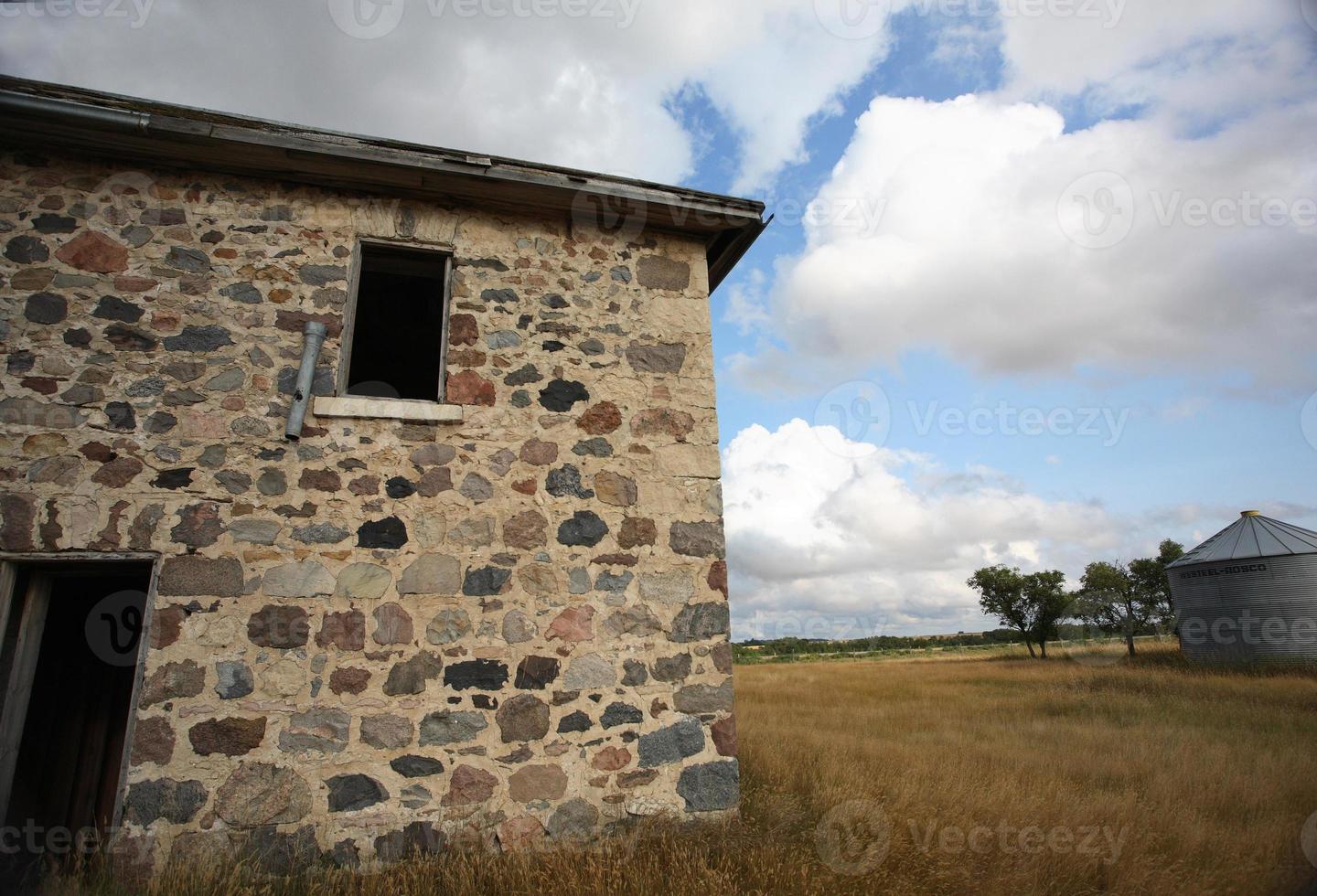 Abandoned stone house in scenic Saskatchewan photo