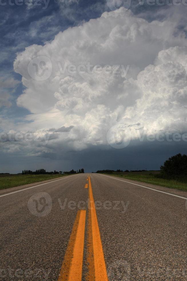 Storm clouds down a Saskatchewan highway photo