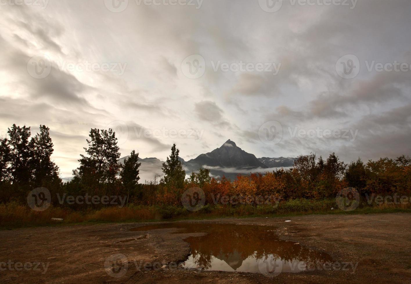 Reflection in puddle of British Columbia mountain photo