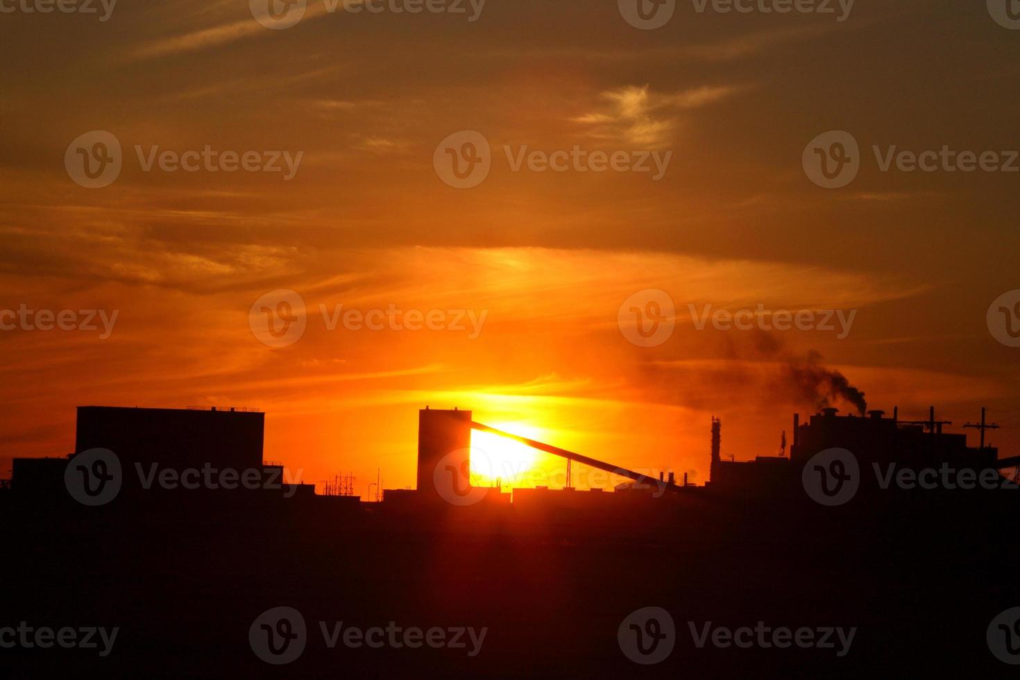 Sun setting behind Mosaic Potash Mine in Saskatchewan photo