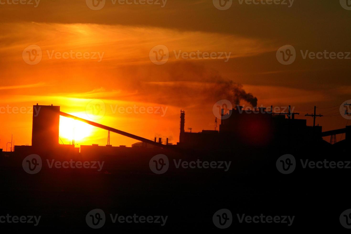 Sun setting behind Mosaic Potash Mine in Saskatchewan photo